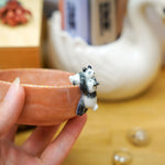 Small porcelain bowl with goofy pandas