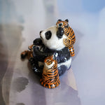 Panda with annoying tigers