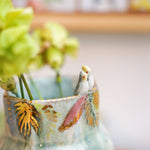 Ceramic vase with two Cockatiels Parrots