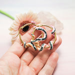 Matte pastel snake with shiny galaxy stripe earrings gold