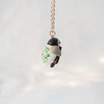 Baby penguin with a Mr.gingerbread pendant