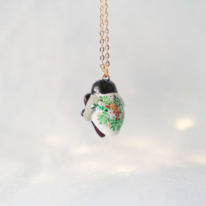 Baby penguin with a Mr.gingerbread pendant