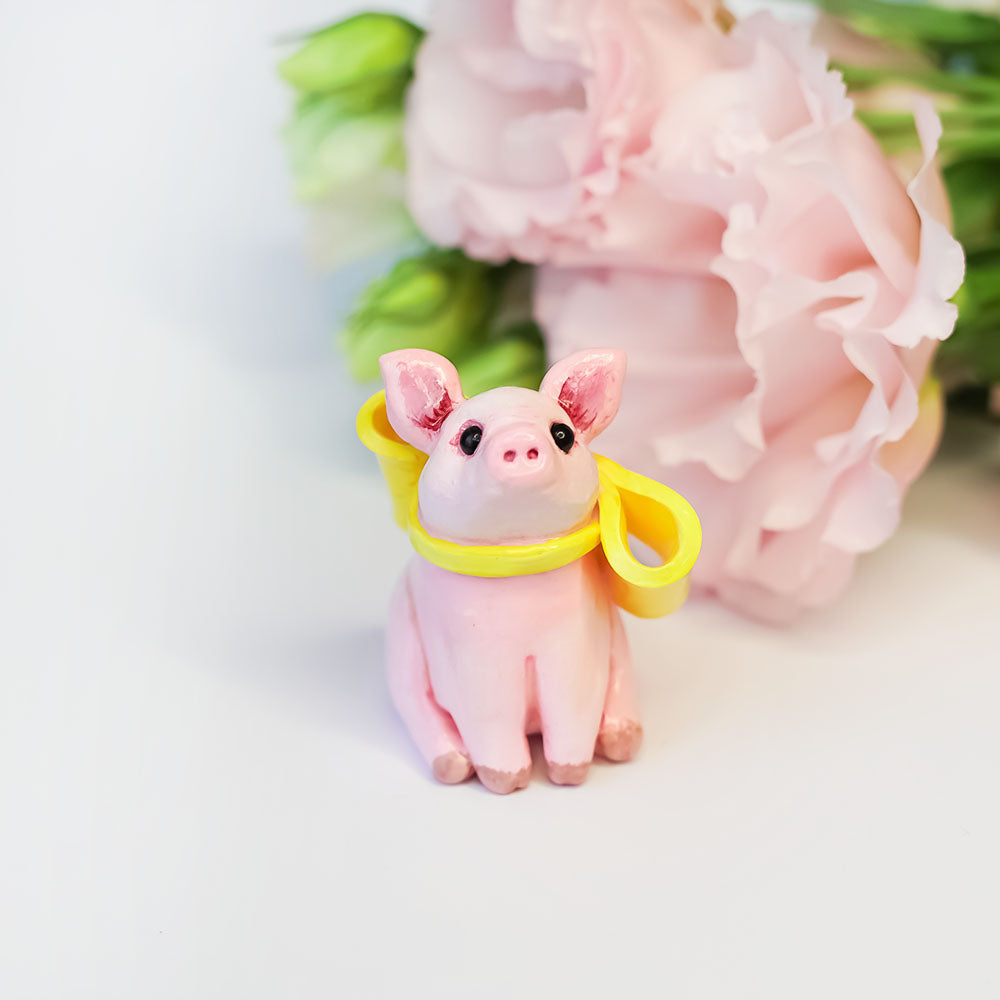 Piggy with a yellow bow