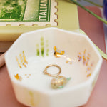 Small porcelain aquarium with a puffer fish