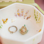 Small porcelain aquarium with a puffer fish