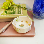 Small porcelain aquarium with a puffer fish
