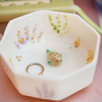 Small porcelain aquarium with a puffer fish