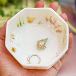 Small porcelain aquarium with a puffer fish