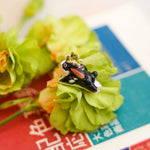 Rabbit with a lilly pendant