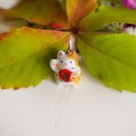 Maneki neko with a flower pendant