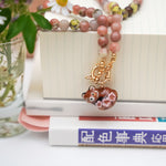 Sakura red panda pendant