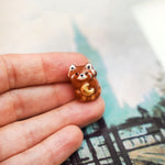 Red panda with a gold moon pendant