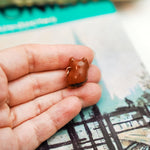 Red panda with a gold moon pendant