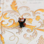 Red panda with a gold star pendant