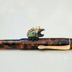 Rhinoceros beetle with a gold star pendant