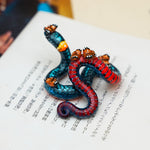 Regal ring-necked snake with butterflies