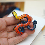 Regal ring-necked snake with butterflies