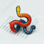 Regal ring-necked snake with butterflies