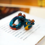 Regal ring-necked snake with butterflies