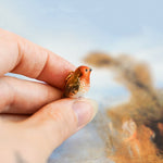 Robin with a lace pendant