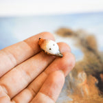 Robin with a lace pendant