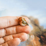 Robin with a lace pendant