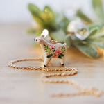 Roe-deer with Christmas flowers pendant