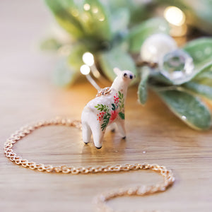 Roe-deer with Christmas flowers pendant