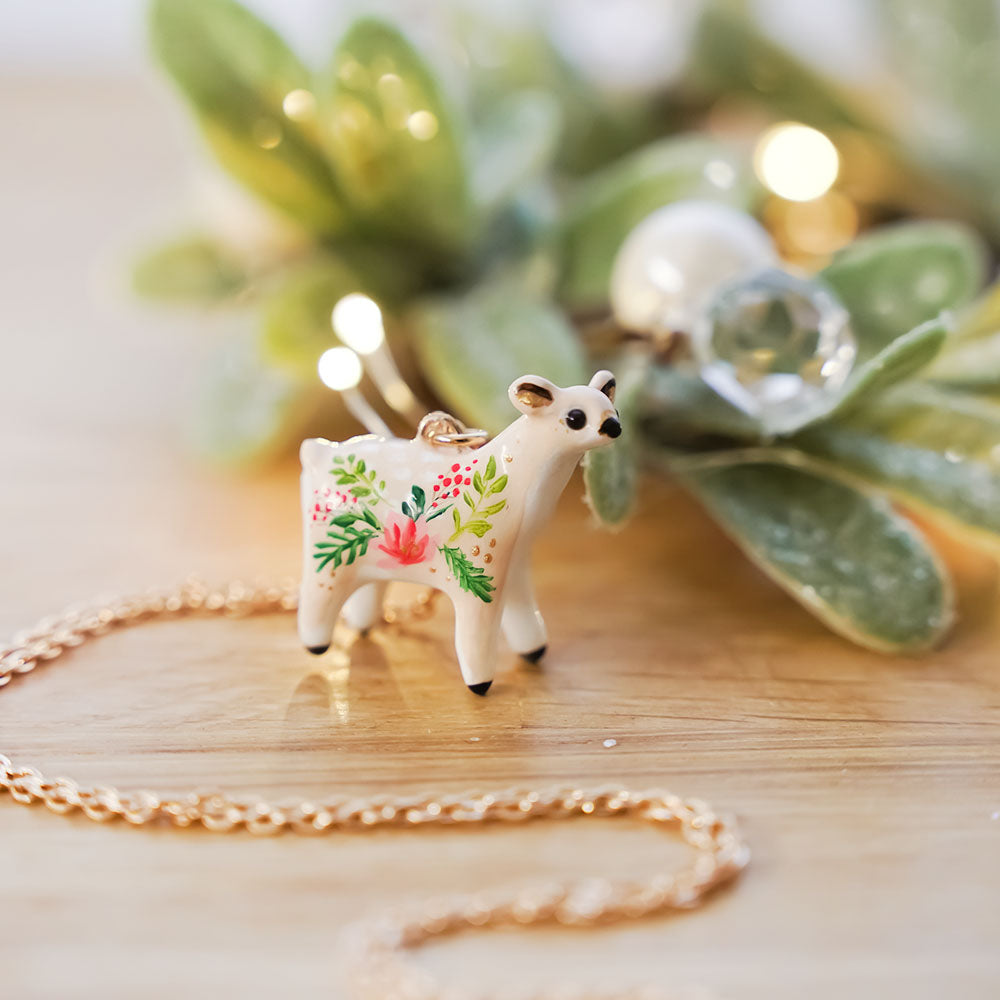 Roe-deer with Christmas flowers pendant