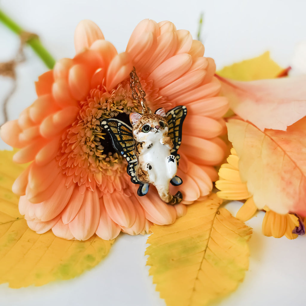 Sand cat with butterfly wings pendant