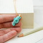 Sea horse with a star pendant