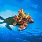 Green turtle with ringed octopus and school of fish figurine