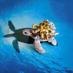 Green turtle with ringed octopus and school of fish figurine