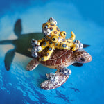 Green turtle with ringed octopus and school of fish figurine