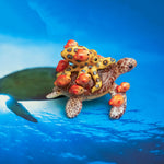 Green turtle with ringed octopus and school of fish figurine