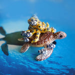Green turtle with ringed octopus and school of fish figurine