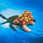 Green turtle with ringed octopus and school of fish figurine