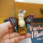 Serval with colorful butterfly wings