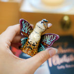 Serval with colorful butterfly wings