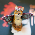 Serval with colorful butterfly wings