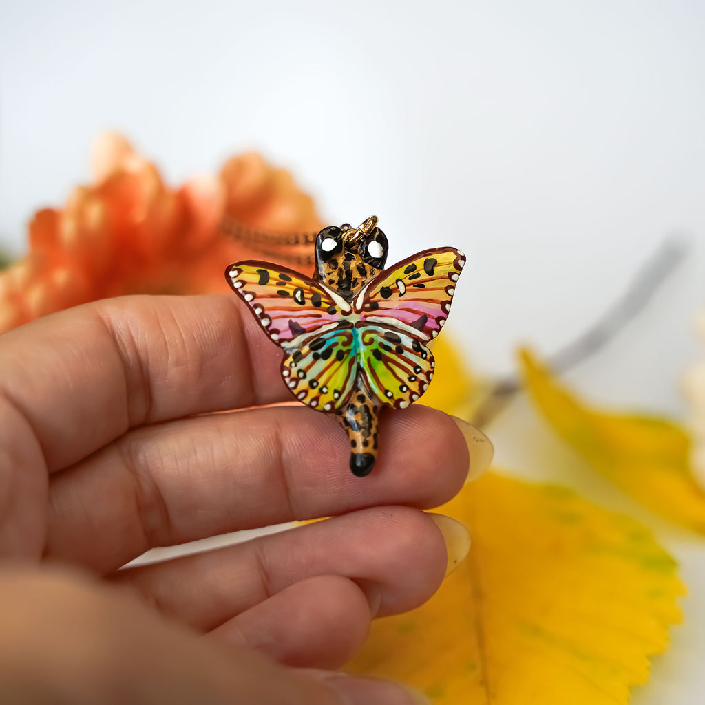 Serval with butterfly wings pendant