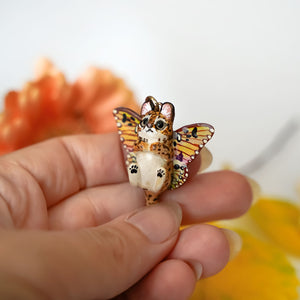 Serval with butterfly wings pendant