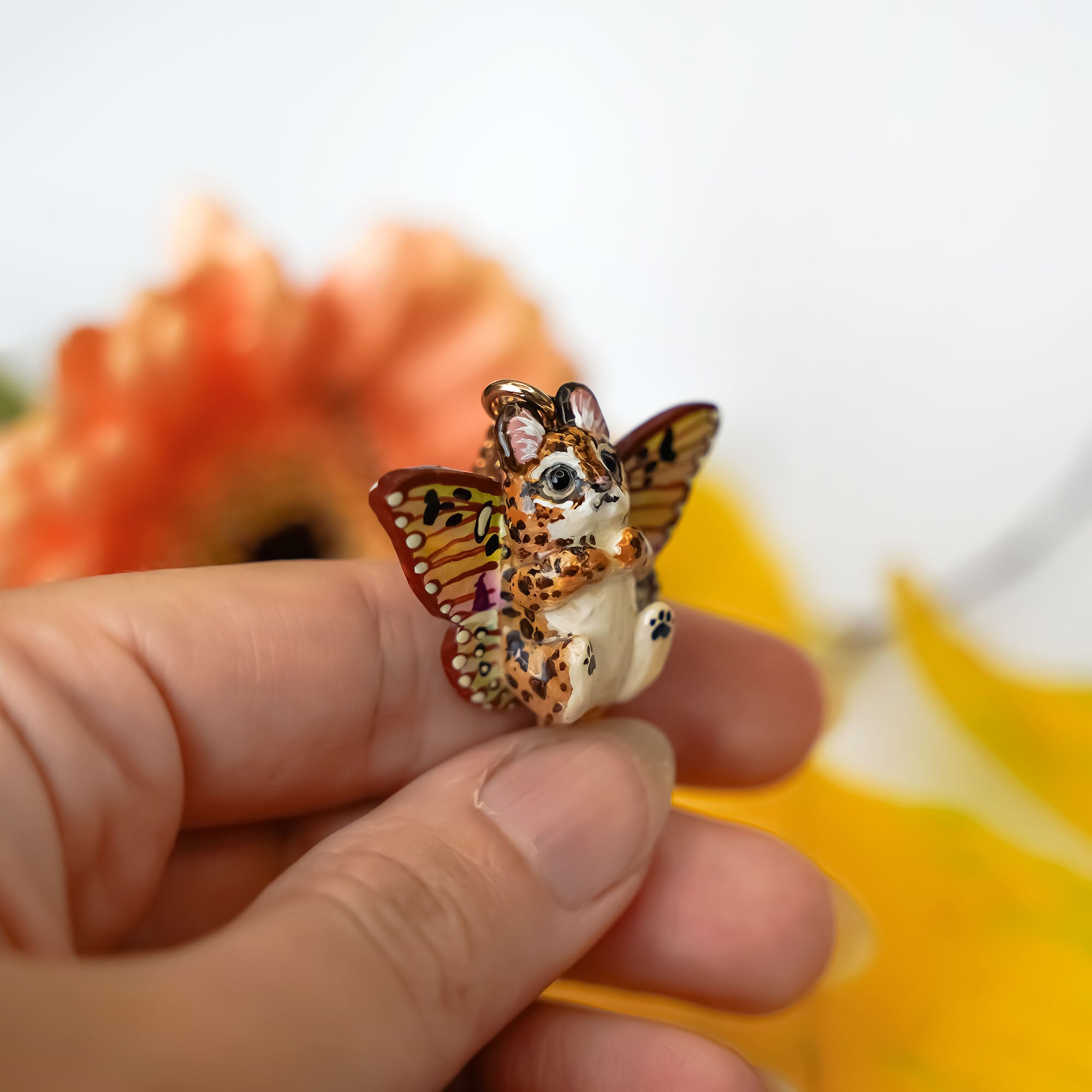 Serval with butterfly wings pendant