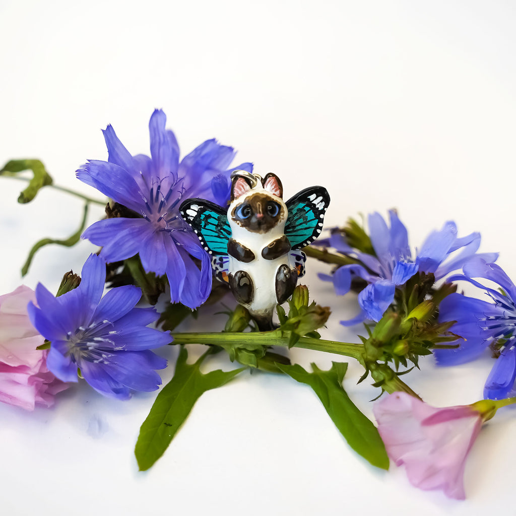Siamese and white cat with butterfly wings pendant