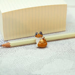 Sleeping fox with a star pendant