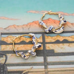 Snake earrings with blue flowers