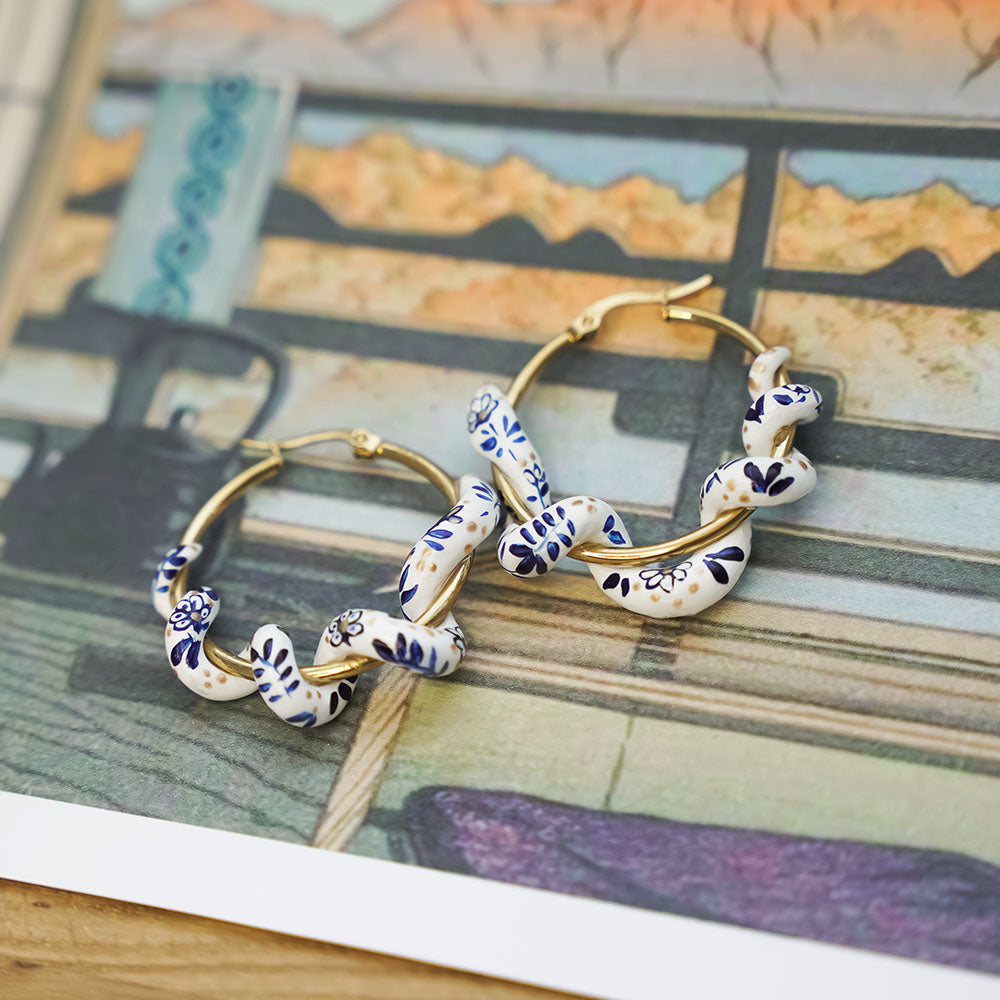Snake earrings with blue flowers