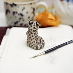 Snow Leopard - hold my leaf - figurine