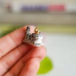 Snow leopard pendant