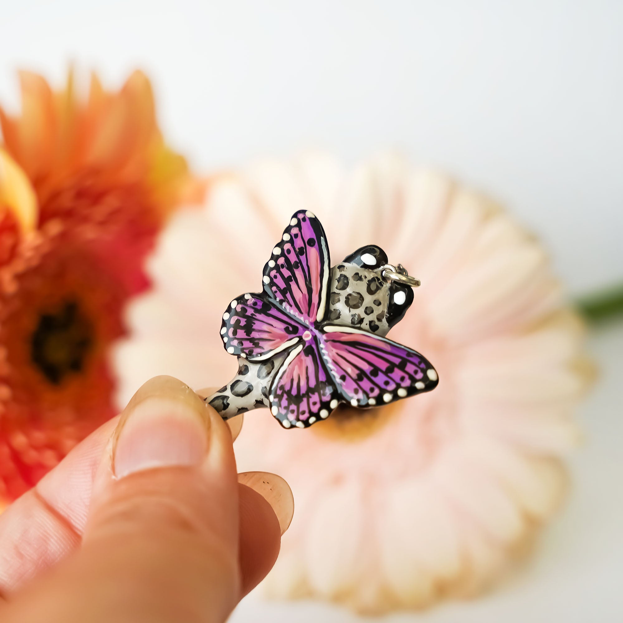 Snow leopard with butterfly wings pendant